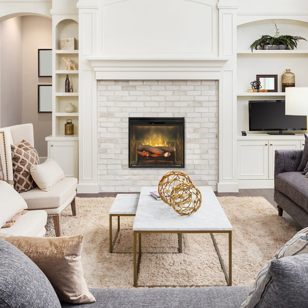 Built-in electric fireplace insert in white brick surround with glowing log flame