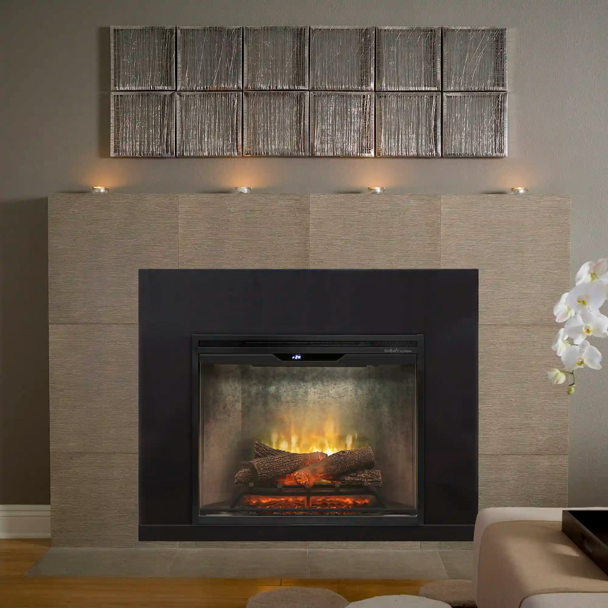 Built-in electric firebox with glowing flames and faux logs in a wall opening