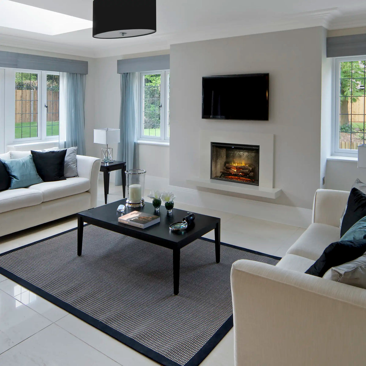 Built-in electric firebox with front glass in a modern living room wall