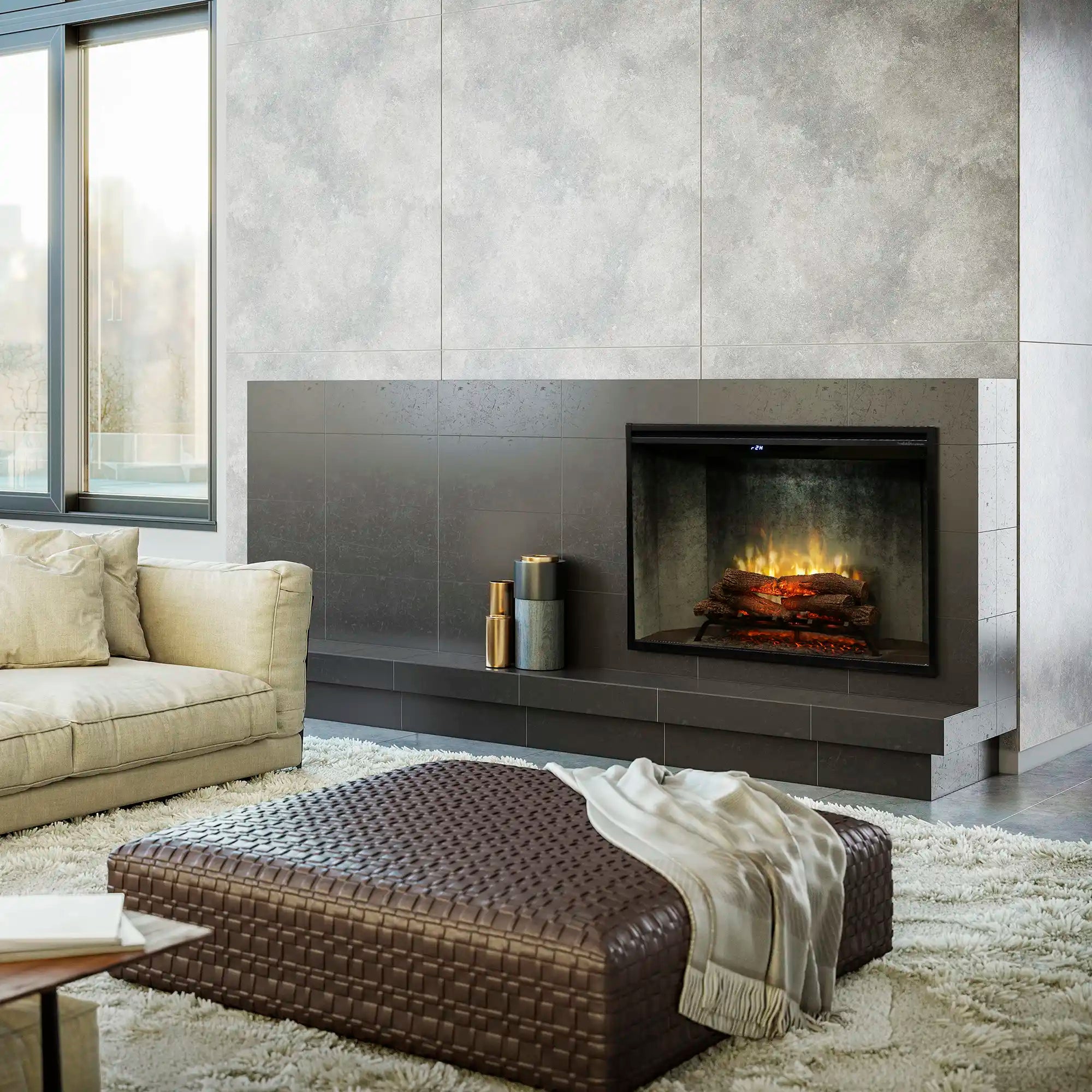 Built-in electric firebox with dark frame set into a gray stone wall surround, flames on