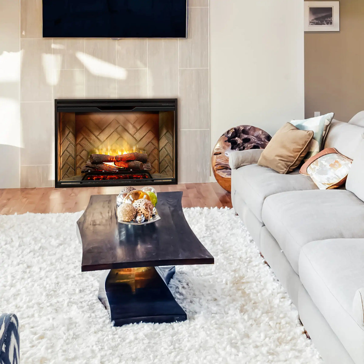 Installed Dimplex built-in electric firebox with herringbone back, burning logs