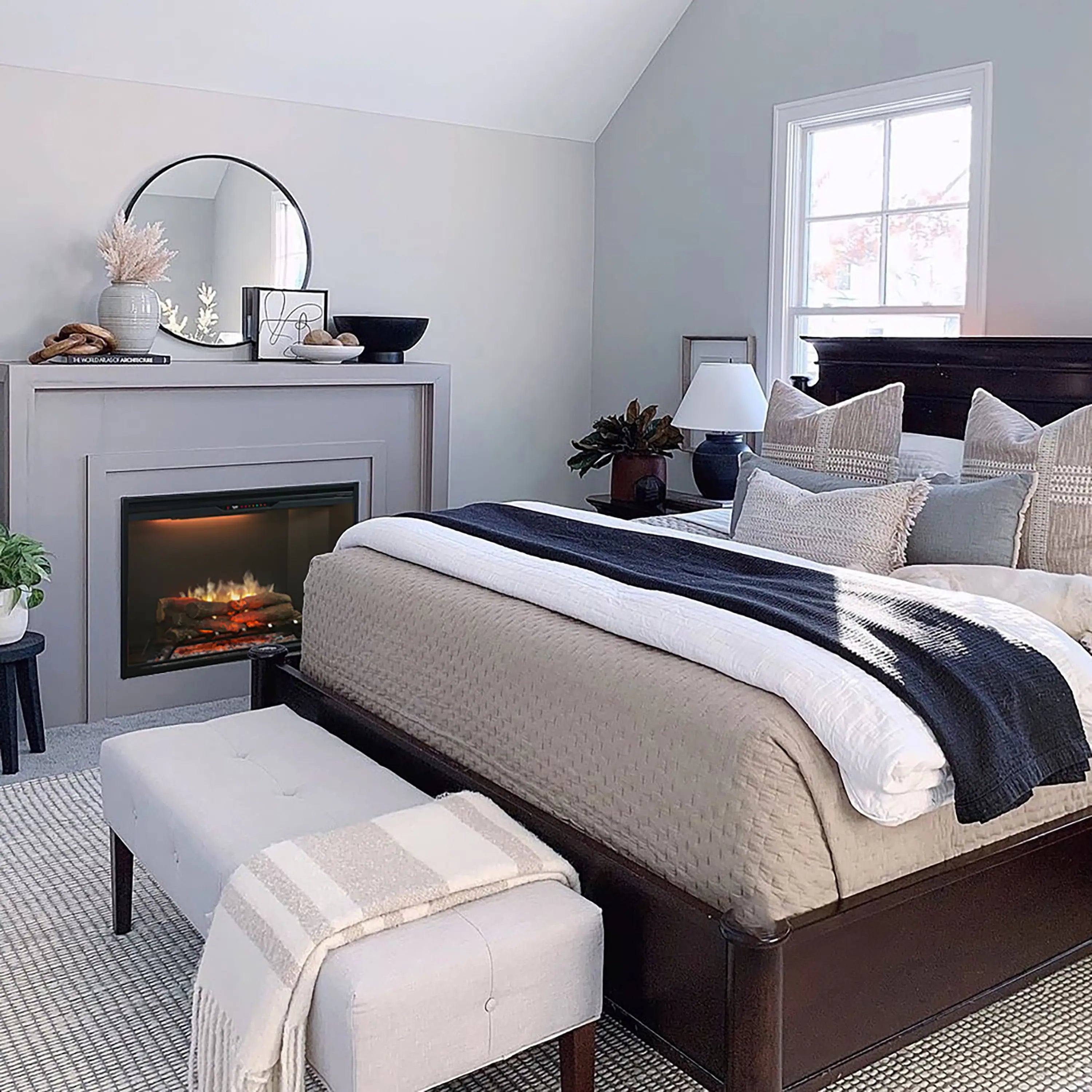 Built-in electric firebox with flame display inside a wall fireplace opening