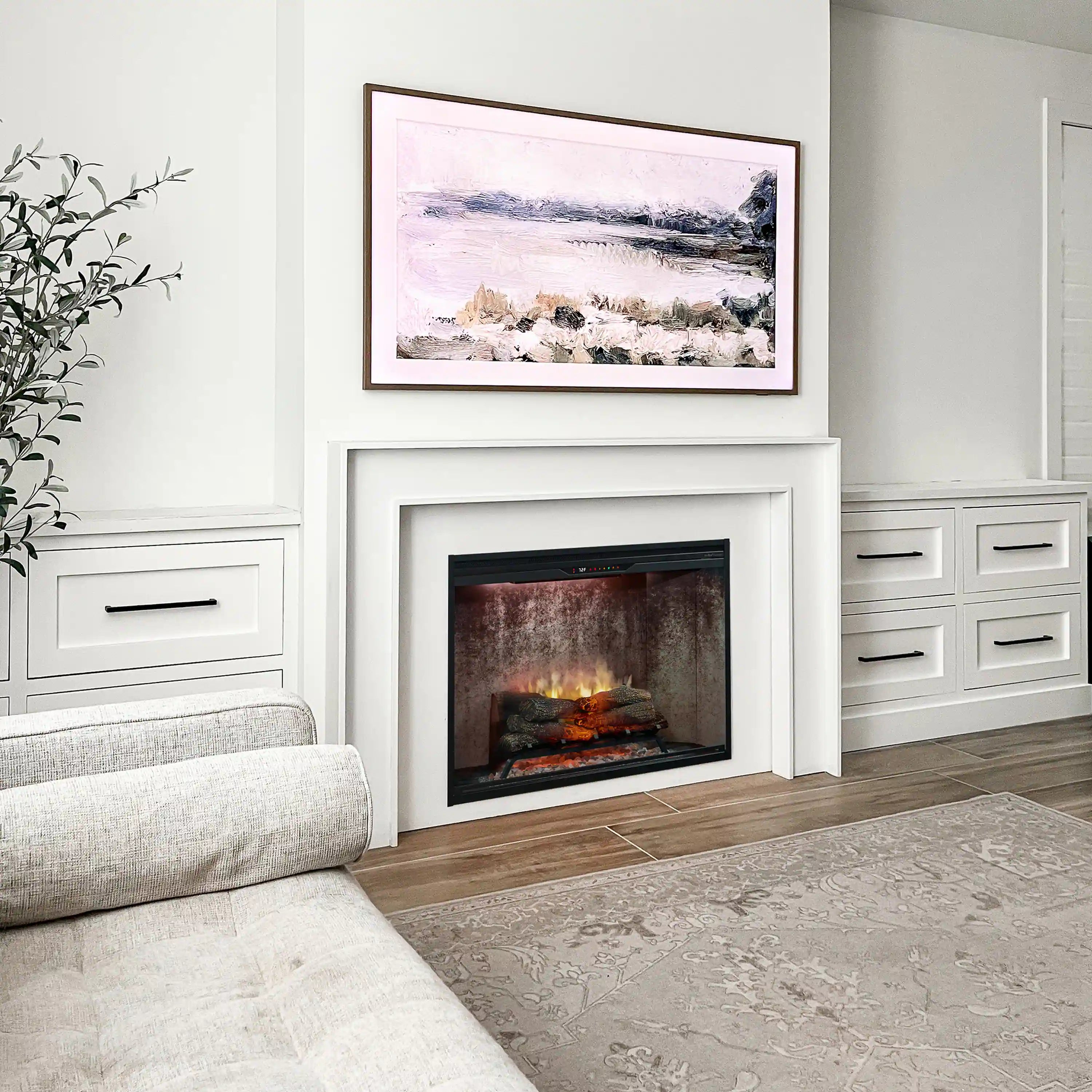 Electric fireplace insert with black frame and interior flame effect in a wall niche