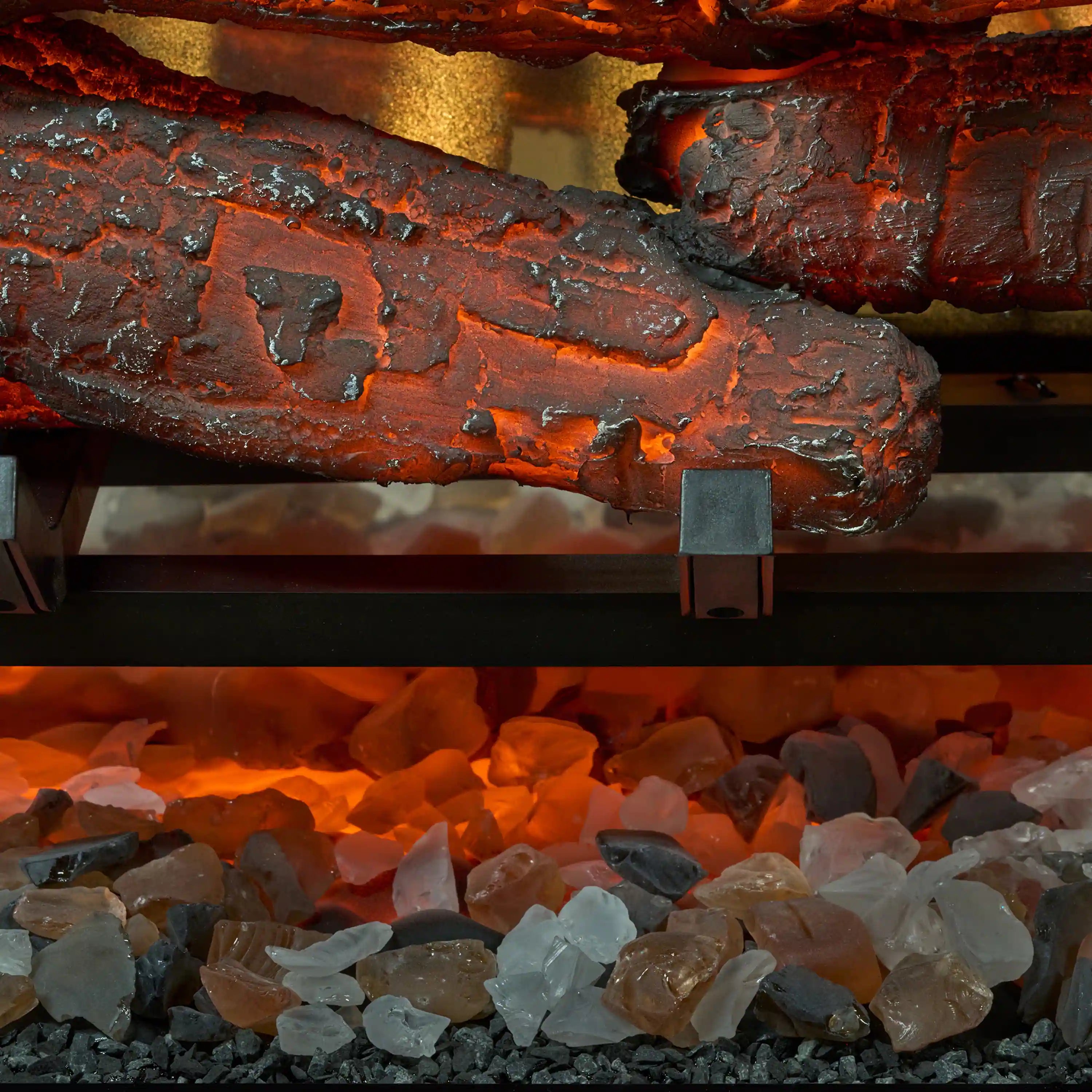 Close-up of glowing orange logs and ember bed inside electric firebox