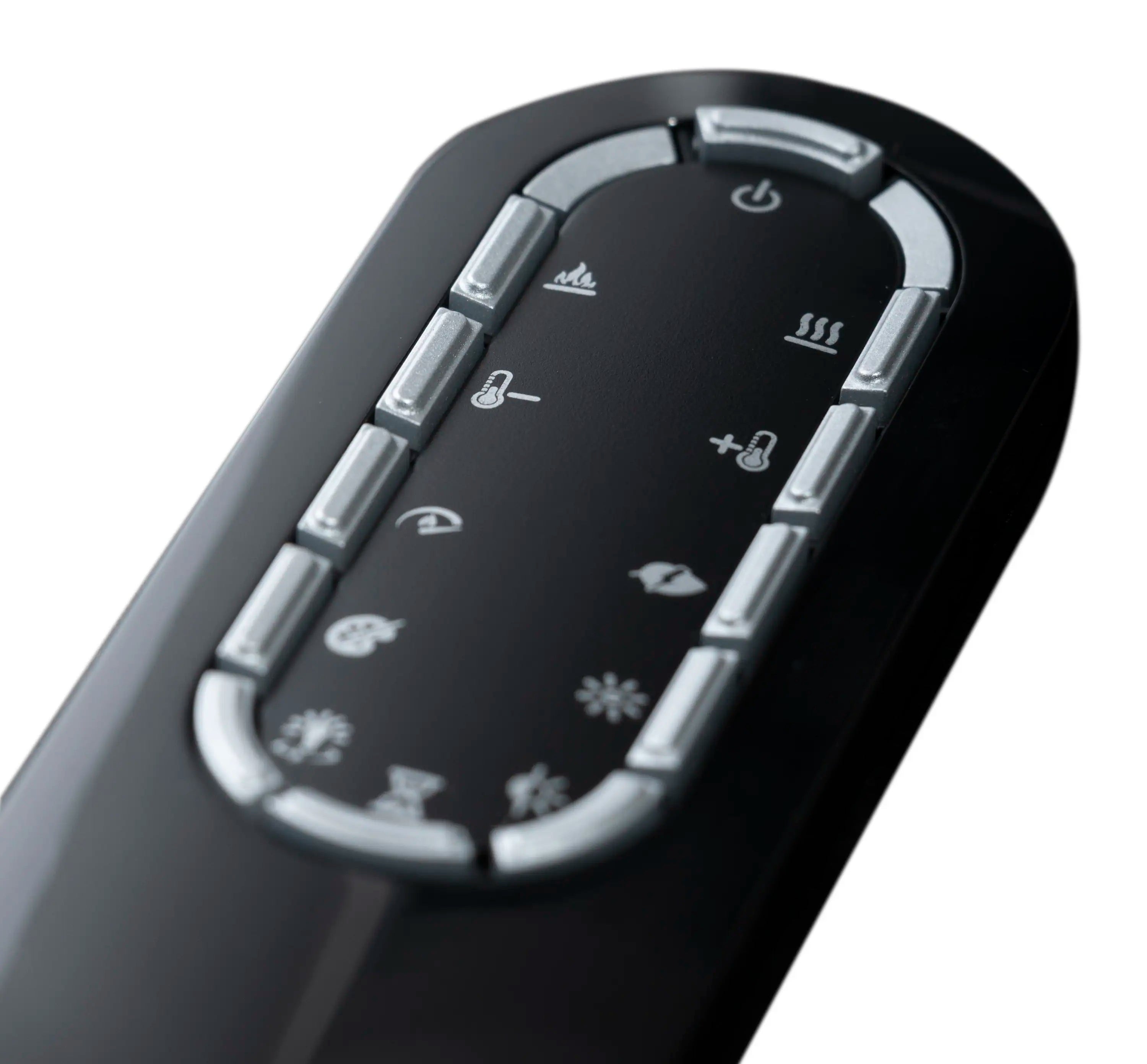 Close-up of black Revillusion fireplace remote control with illuminated buttons