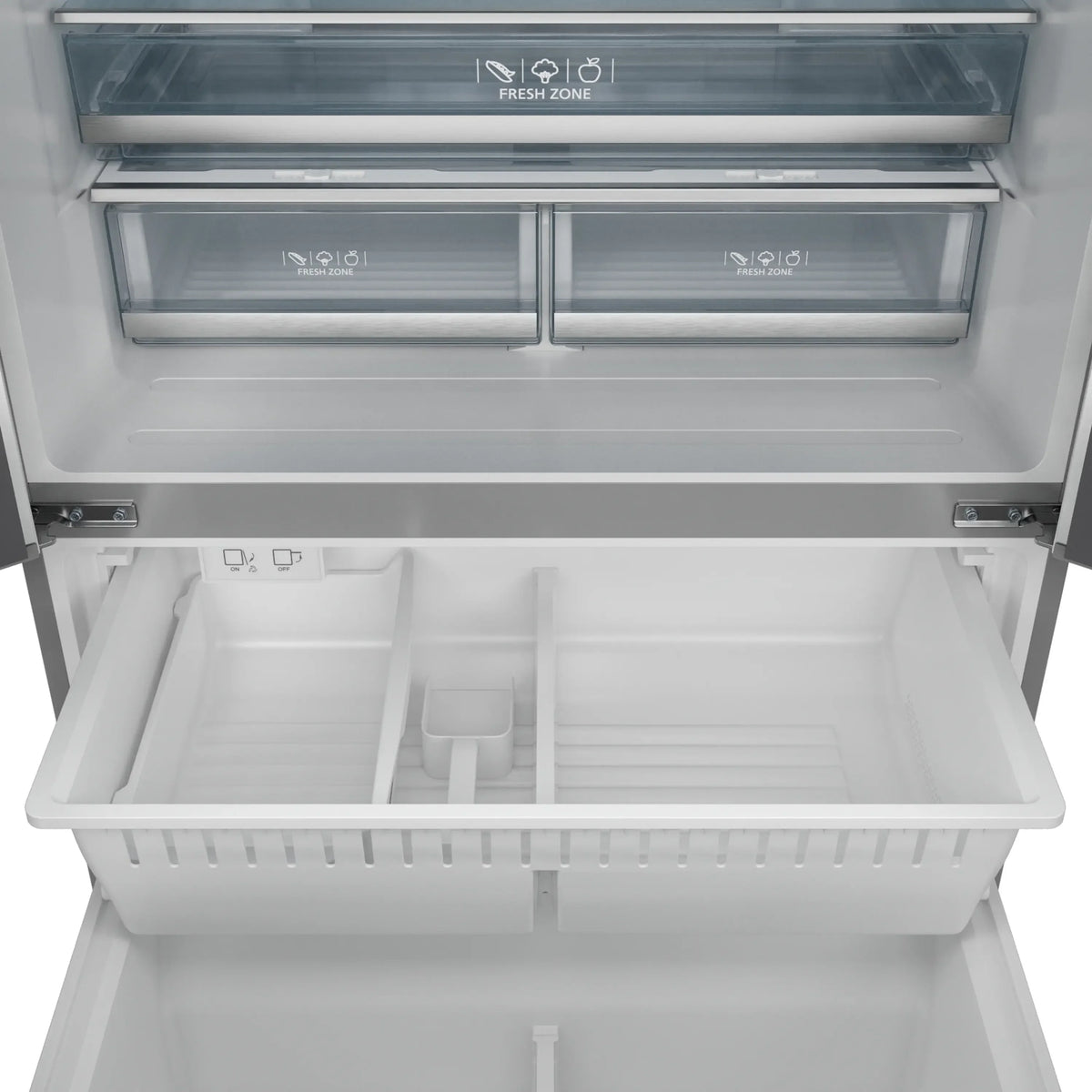 Stainless steel refrigerator top freezer compartment open with frosted door shelves visible