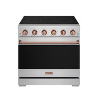Stainless electric range with black cooktop, rose gold control knobs, and closed oven