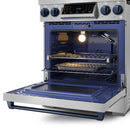 Open oven with blue interior and oven racks on a stainless gas range with navy trim.