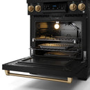 Black gas oven with open door, racks and burner grates, bronze control knobs
