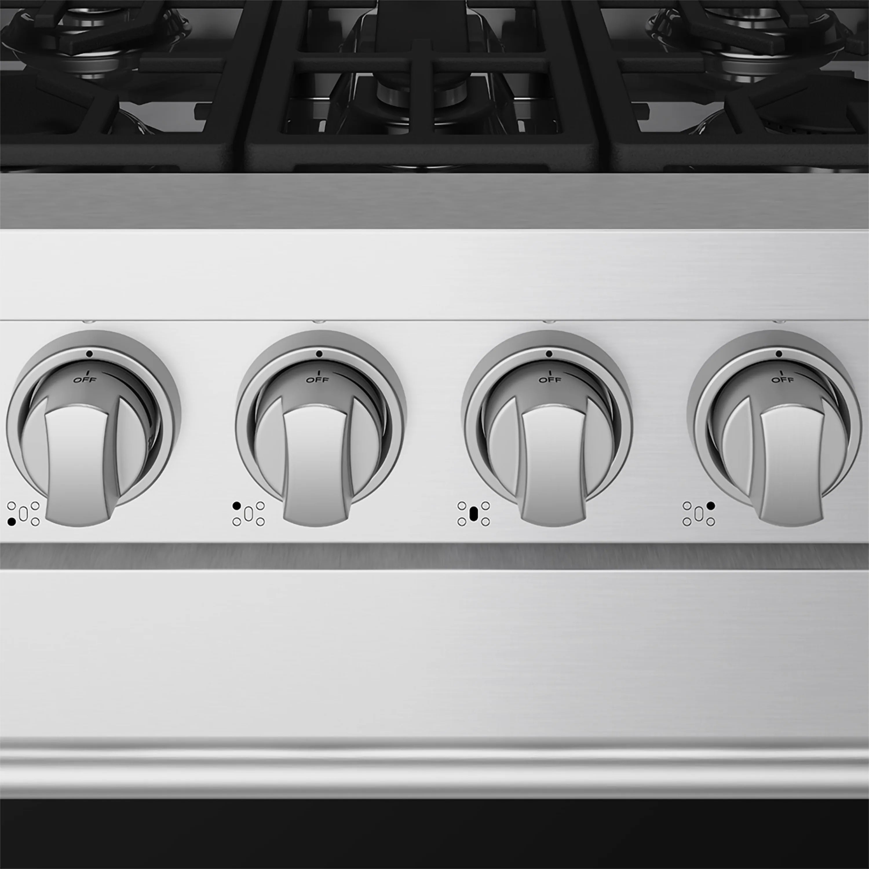 Stainless steel control panel with four burner knobs and control markings