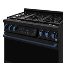 Close view of black gas range control panel with blue knobs and cooktop grates