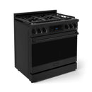 Angled view of black professional gas range with grates and control knobs