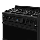 Close-up of black gas range control panel with display and burner knobs
