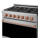 Stainless steel gas range front panel with copper precision knobs and rose-gold trim