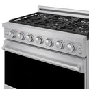 Stainless steel gas range front with control knobs and black cooktop grates
