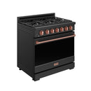 Black gas range with open top grates, rose-gold control knobs and copper trim bar