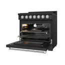 Black gas range with open oven door showing bake tray and flame burner, stainless handle.