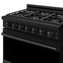 Black gas range with front control knobs and cooktop burner grates
