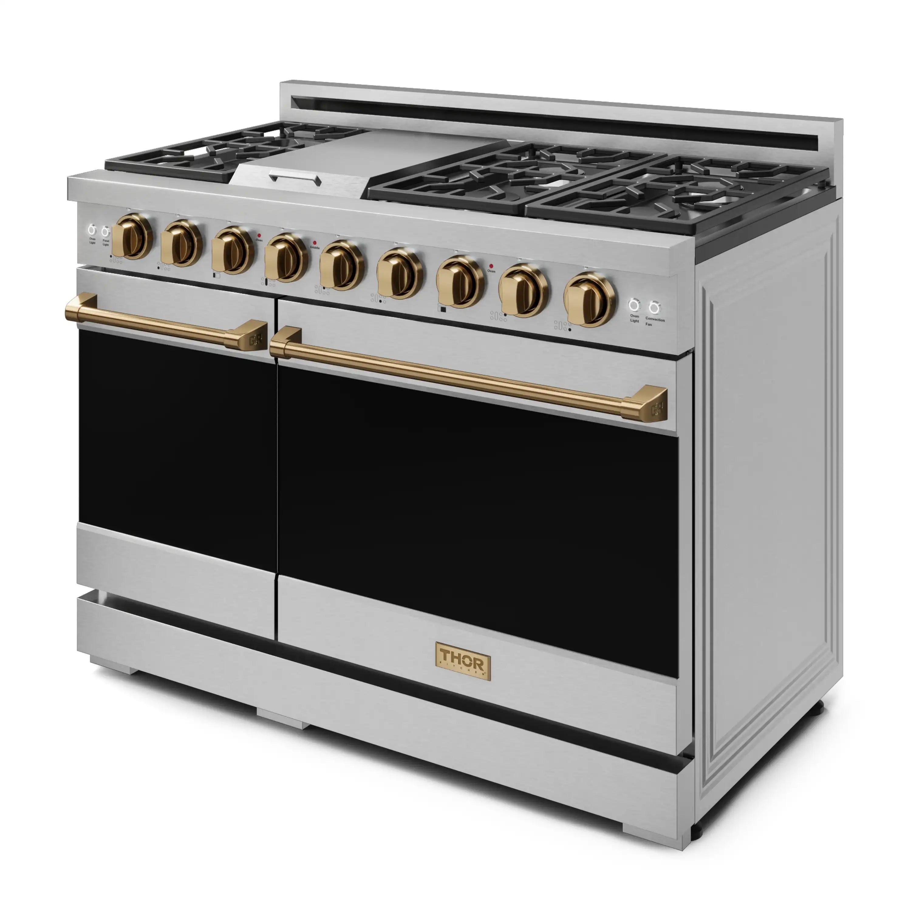 Stainless steel gas range angled view with gold handles and black oven doors