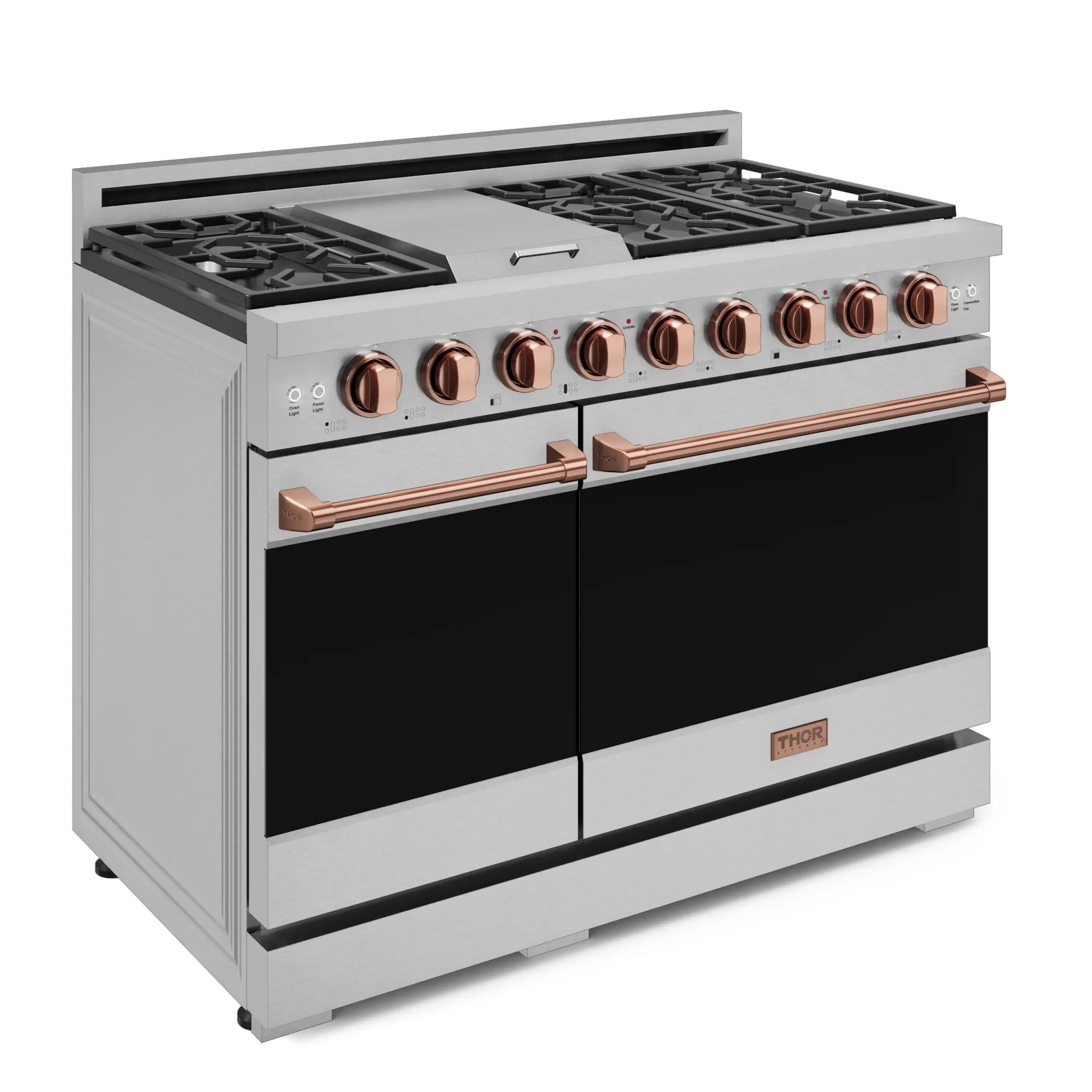 Stainless steel gas range with open grates, rose-gold knobs, and black ovens