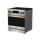 Stainless steel induction range corner view with black oven door and bronze control knobs
