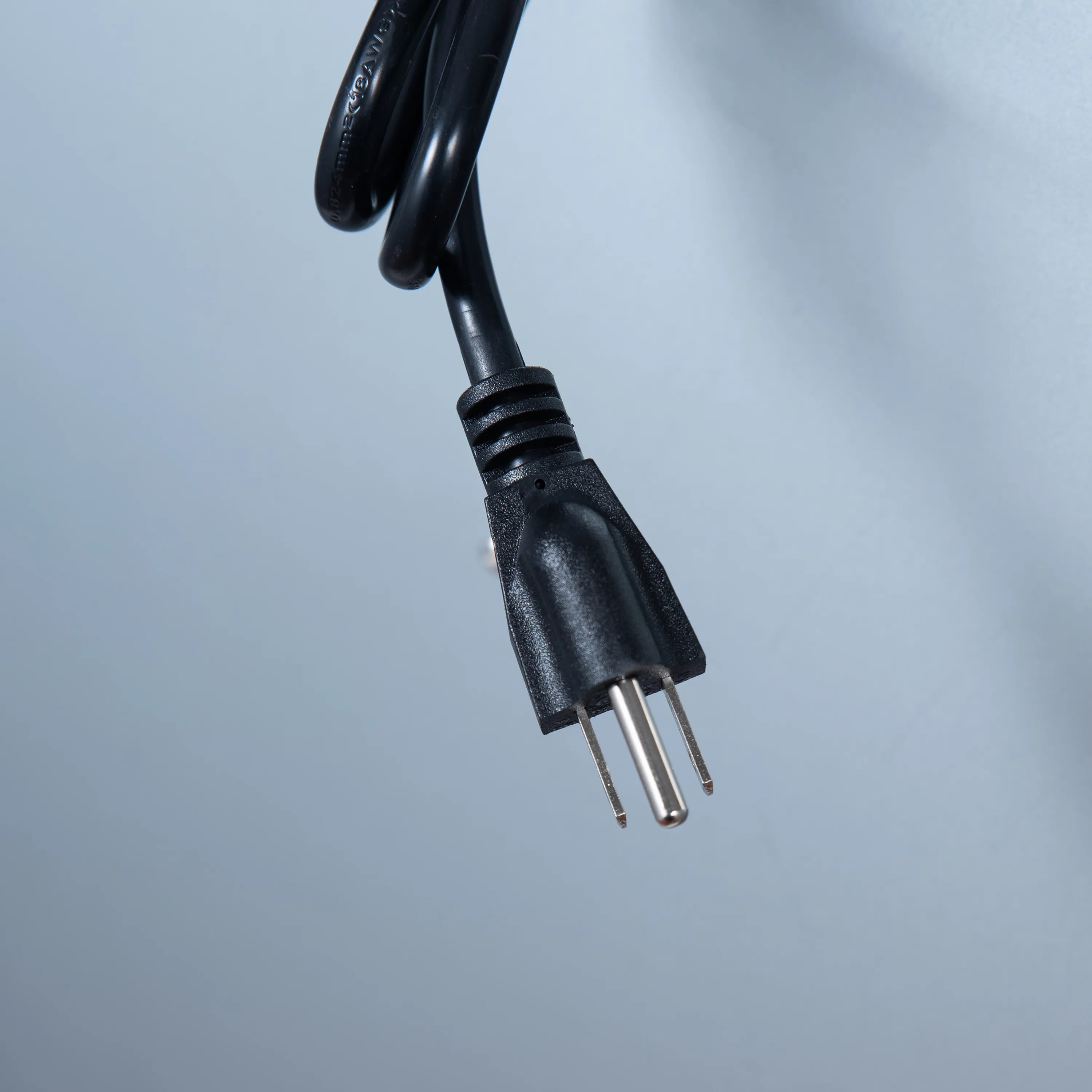 Range hood power cord with three-prong plug and black strain relief