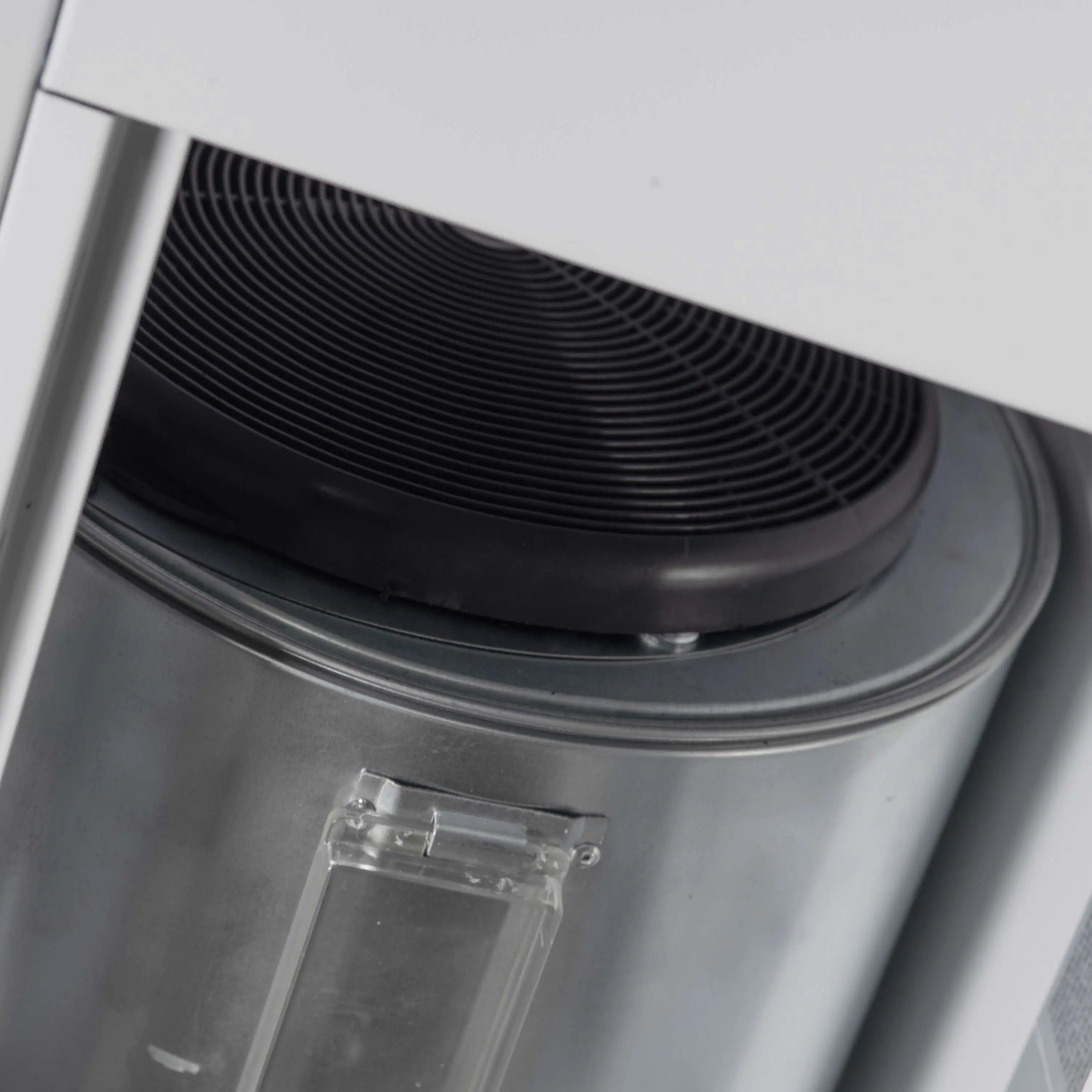 Black gas cooktop burner with curved ridged surface and metal base