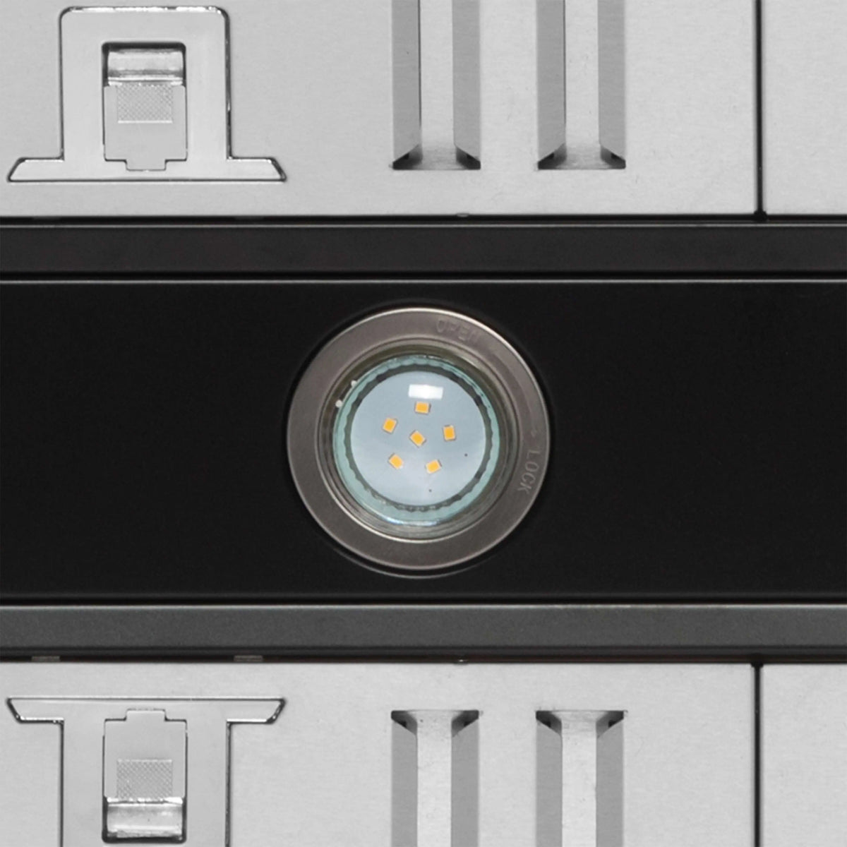Black wall mount range hood front panel with centered round LED light