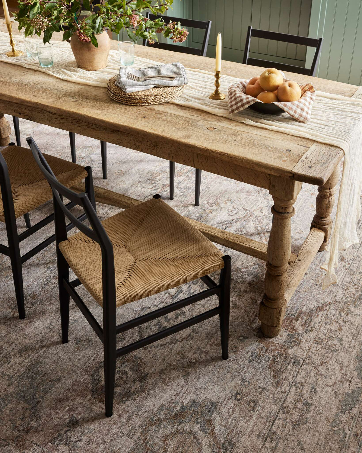 Runner rug with distressed texture and muted geometric motifs in blush and dove tones.