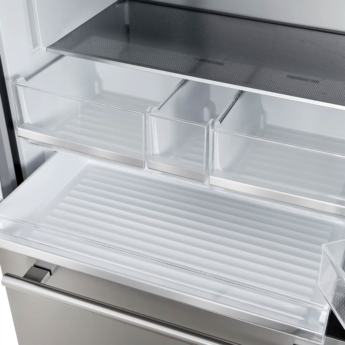Refrigerator freezer compartment with clear sliding bins and vented mesh shelf at bottom