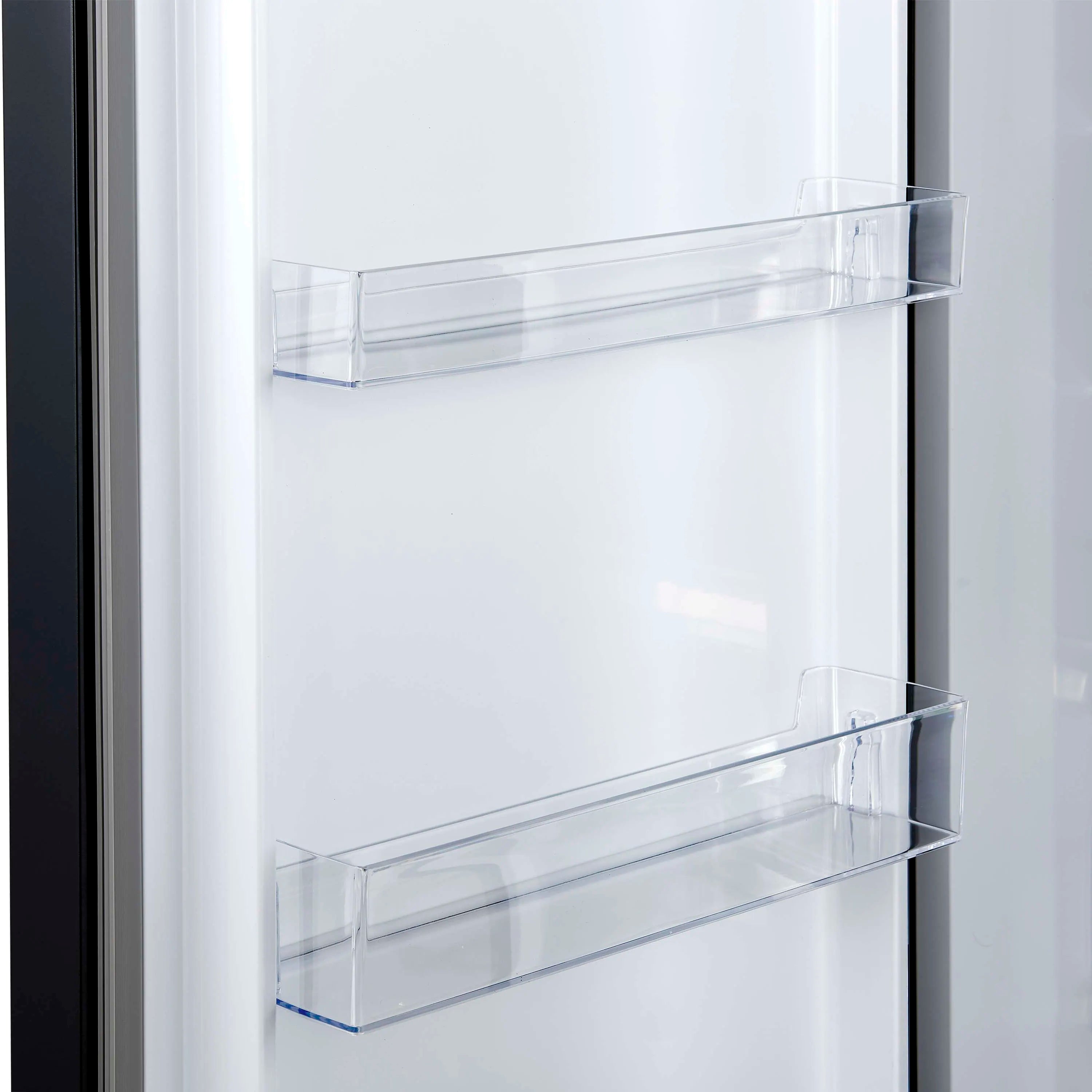Refrigerator door interior with clear glass shelves and storage bins
