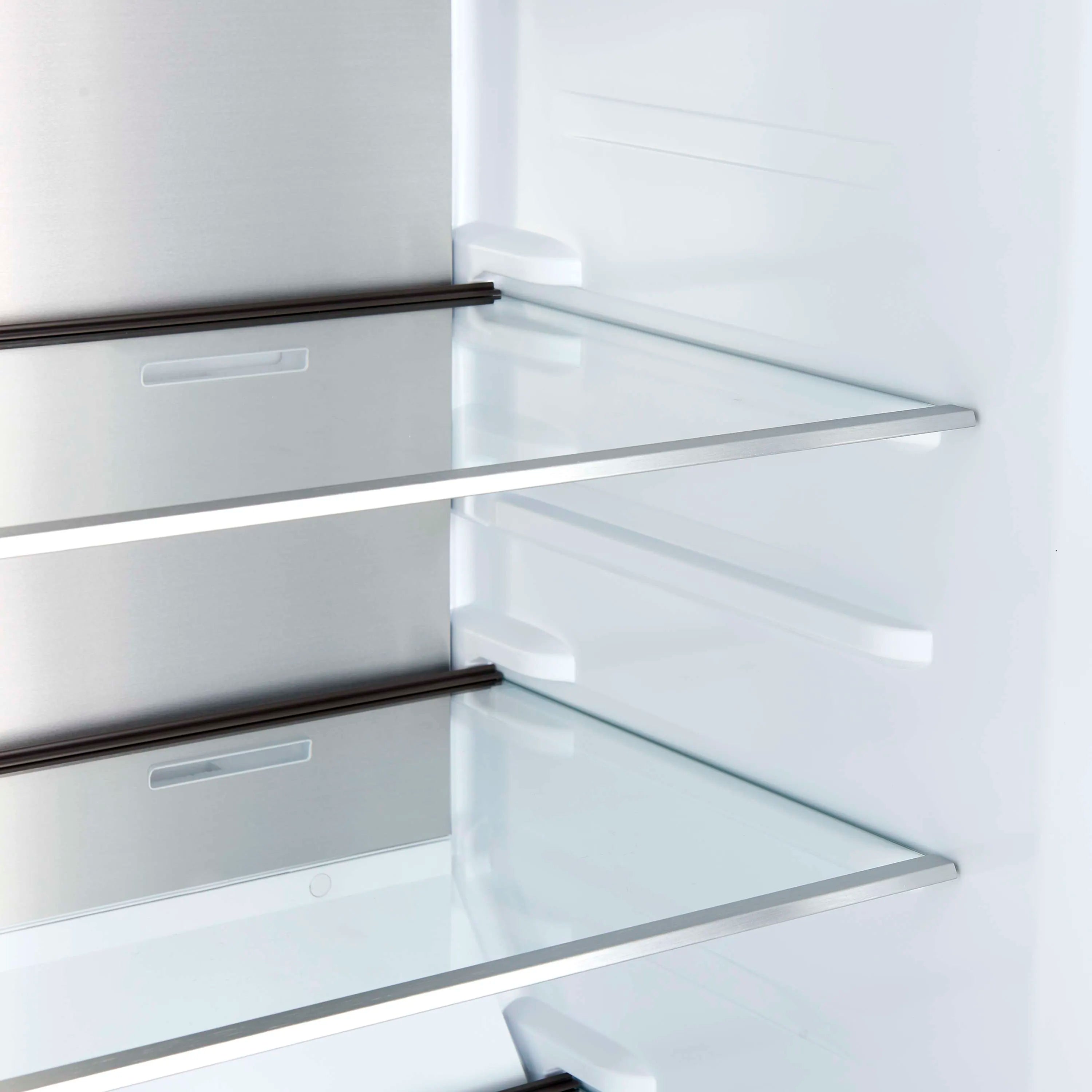Refrigerator side interior with clear glass shelf and white wall bins