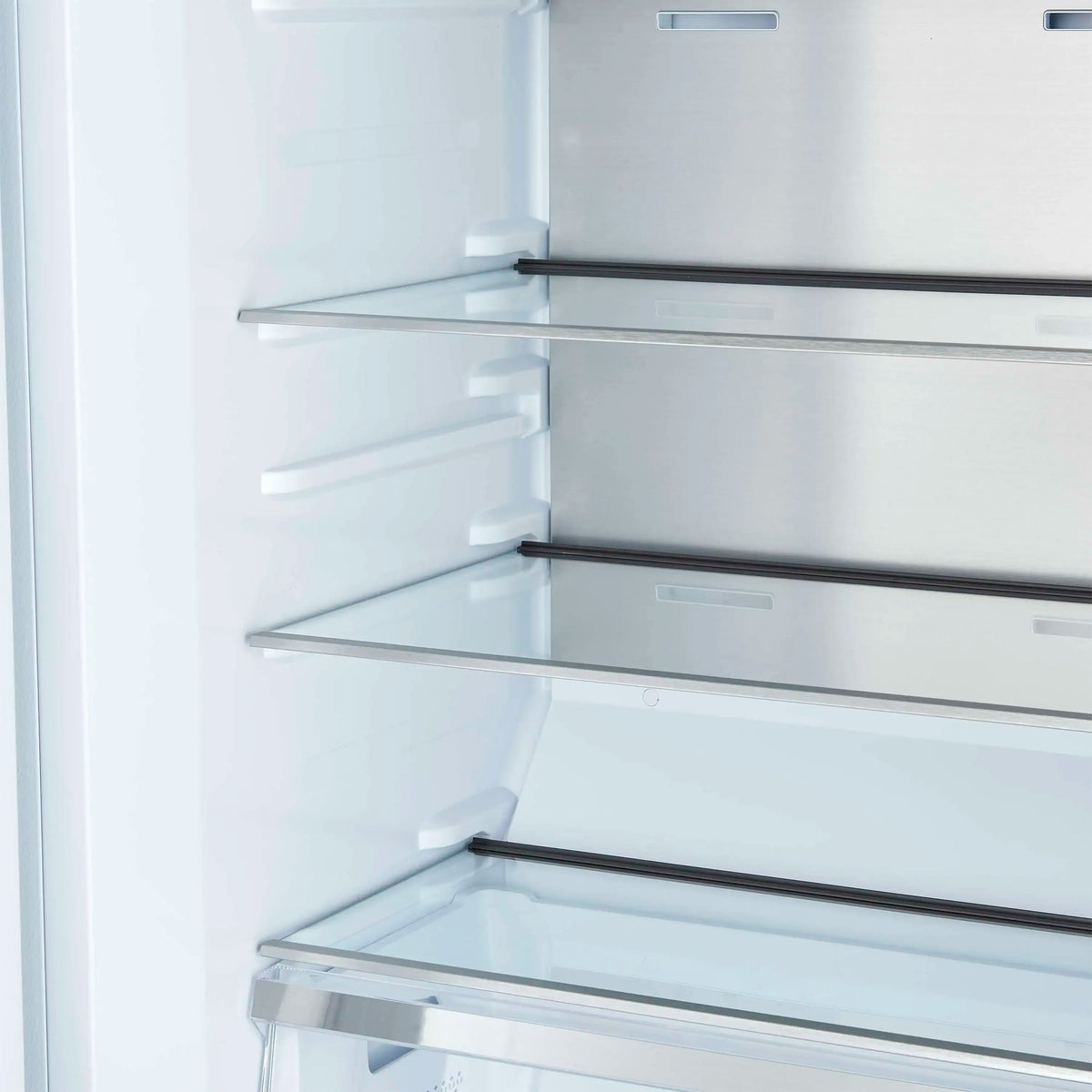 Refrigerator freezer interior with adjustable glass shelves and side ledges