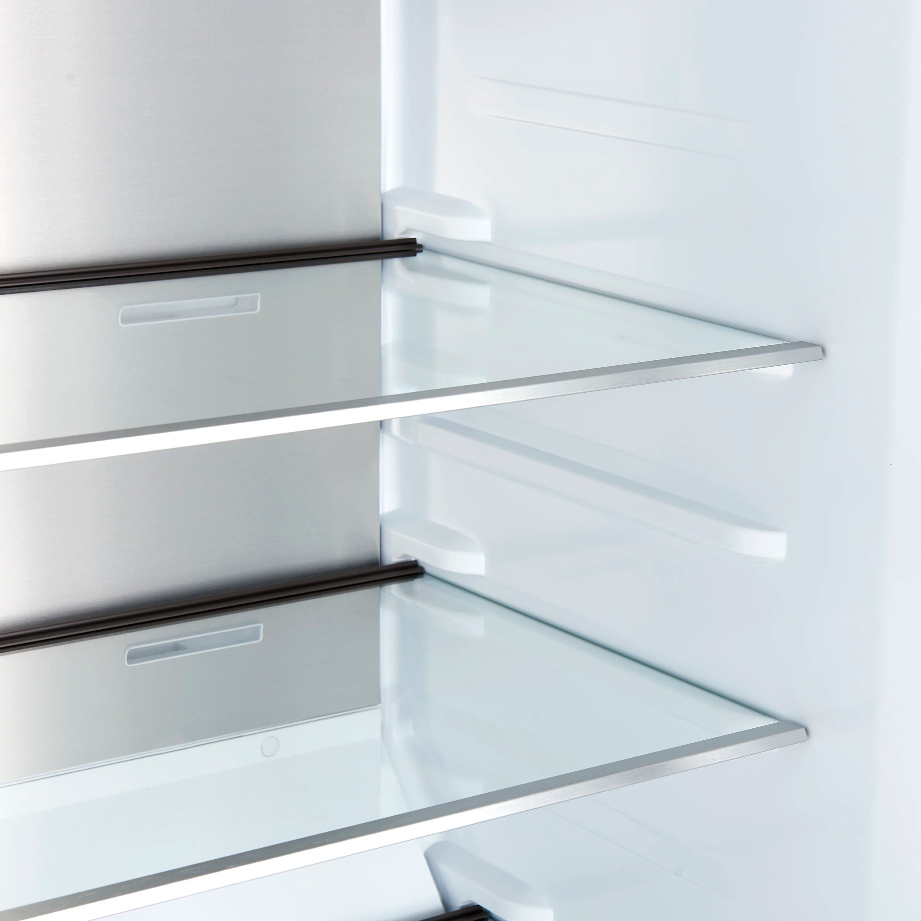 Convertible refrigerator interior with clear glass shelves and white door shelving