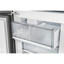 Bottom freezer drawer with ice cubes behind a clear storage cover