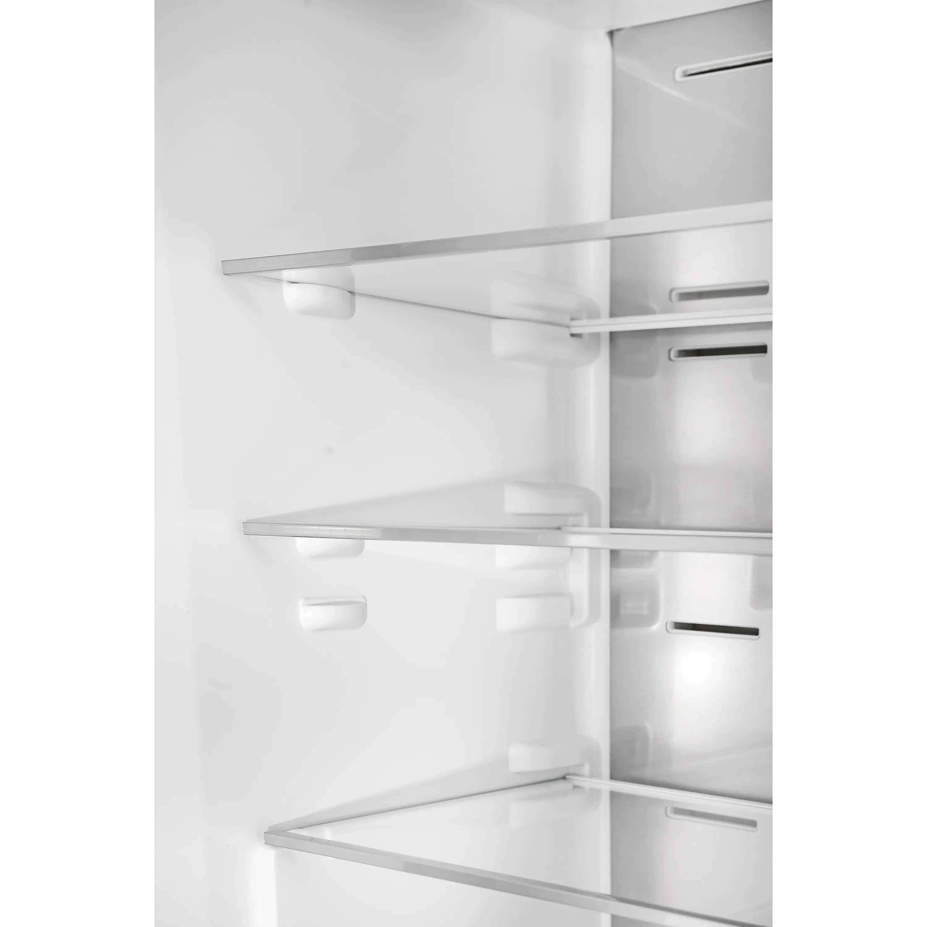 Refrigerator interior with adjustable glass shelves and LED lighting