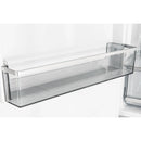 Transparent freezer drawer with mesh base inside white refrigerator-freezer