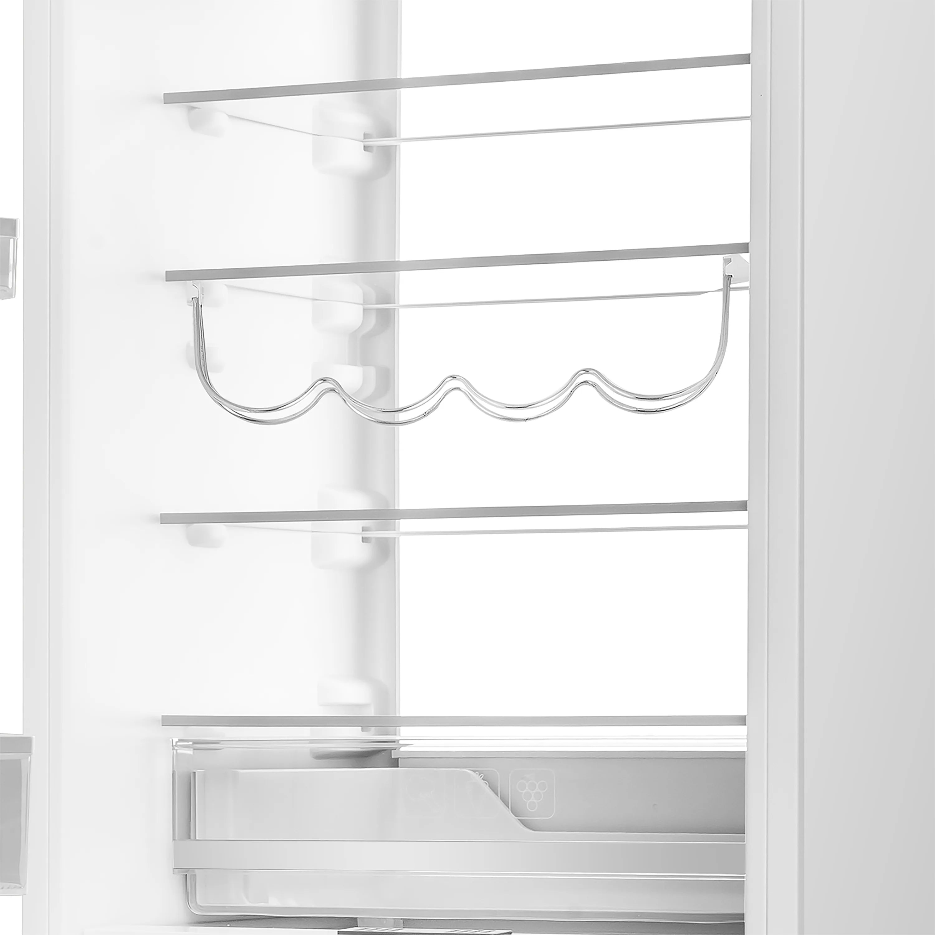 Built-in refrigerator interior with wire bottle rack and top shelf divider