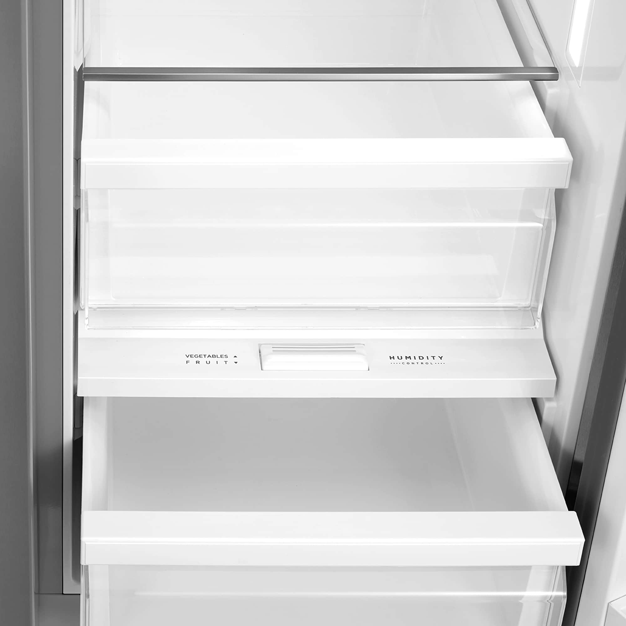 Open refrigerator compartment with clear shelves, humidity and vegetables labels