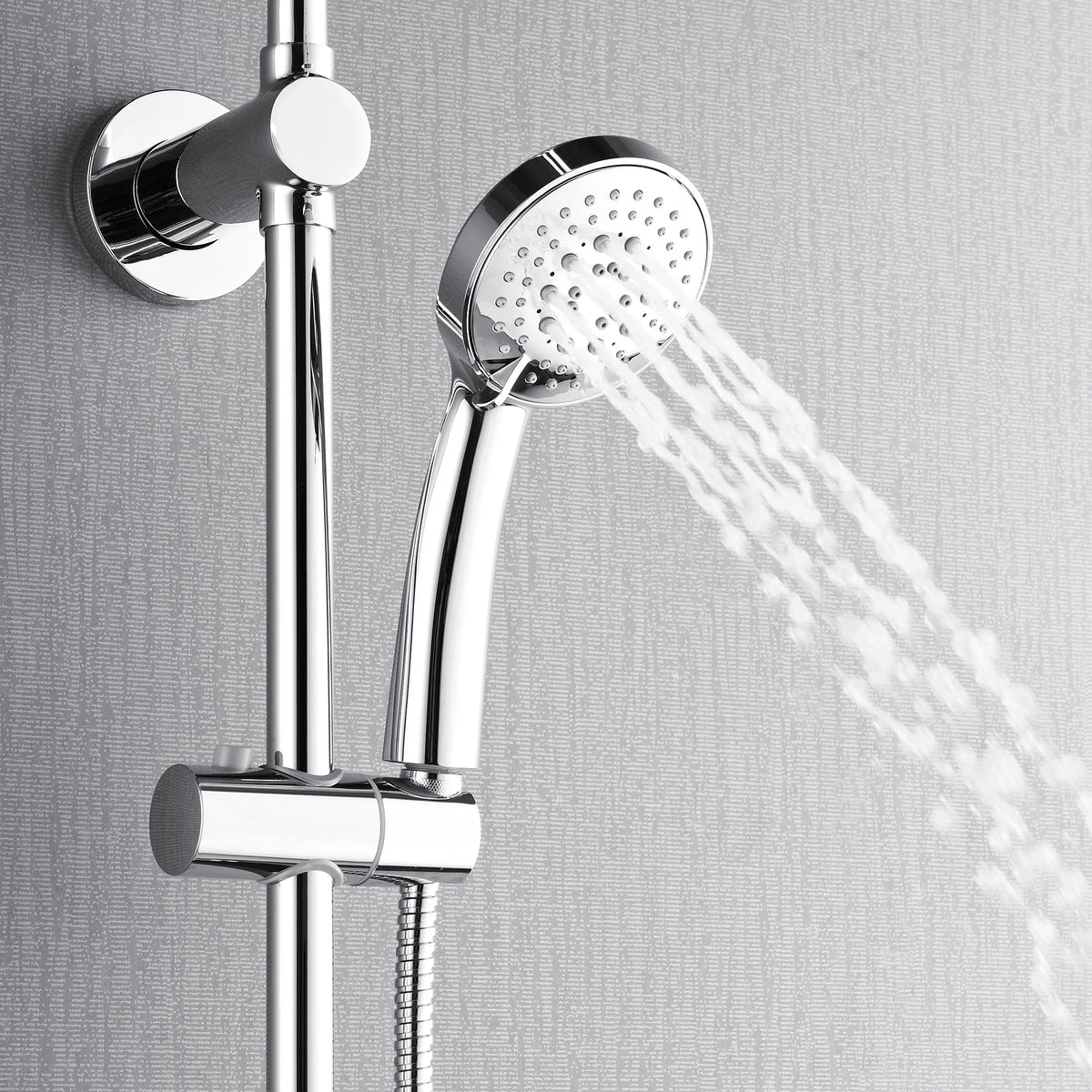 Polished stainless steel rainfall shower head spraying water from round faceplate
