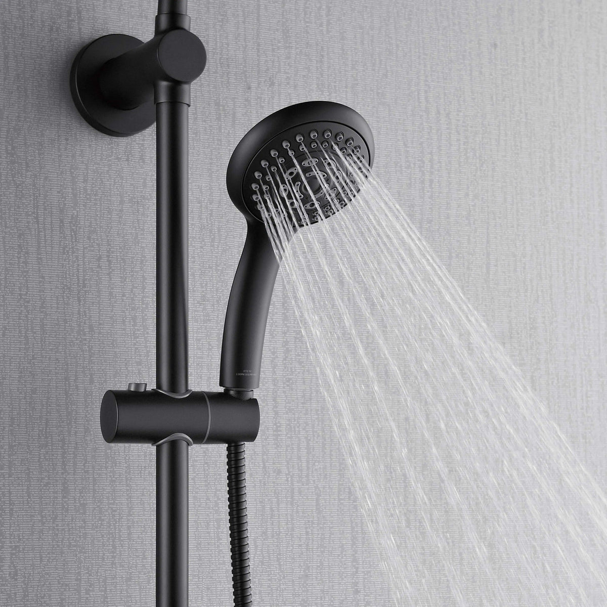 Matte black handheld shower on vertical bar with steady spray stream