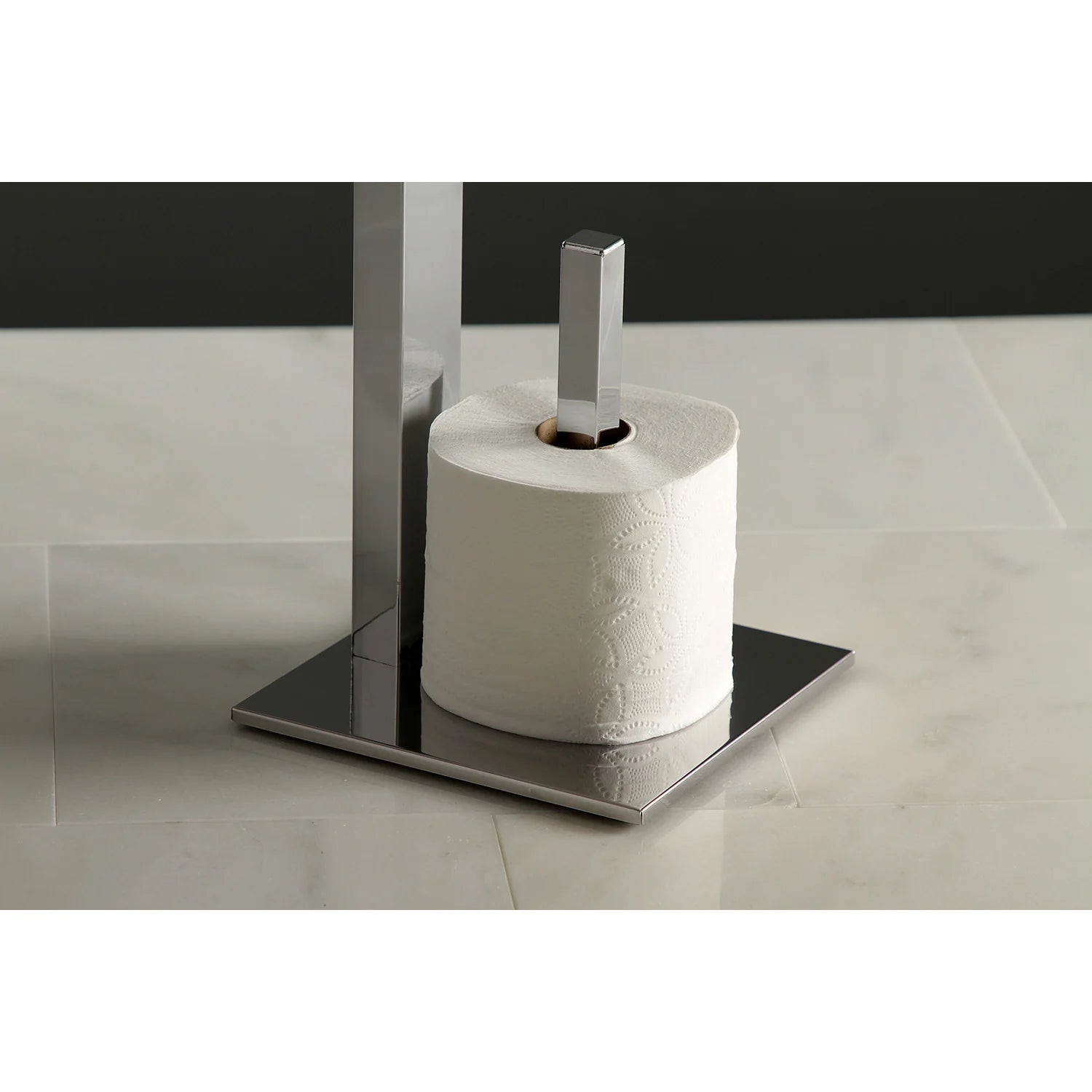 Freestanding toilet paper holder with polished chrome posts and wood shelf, holding a roll