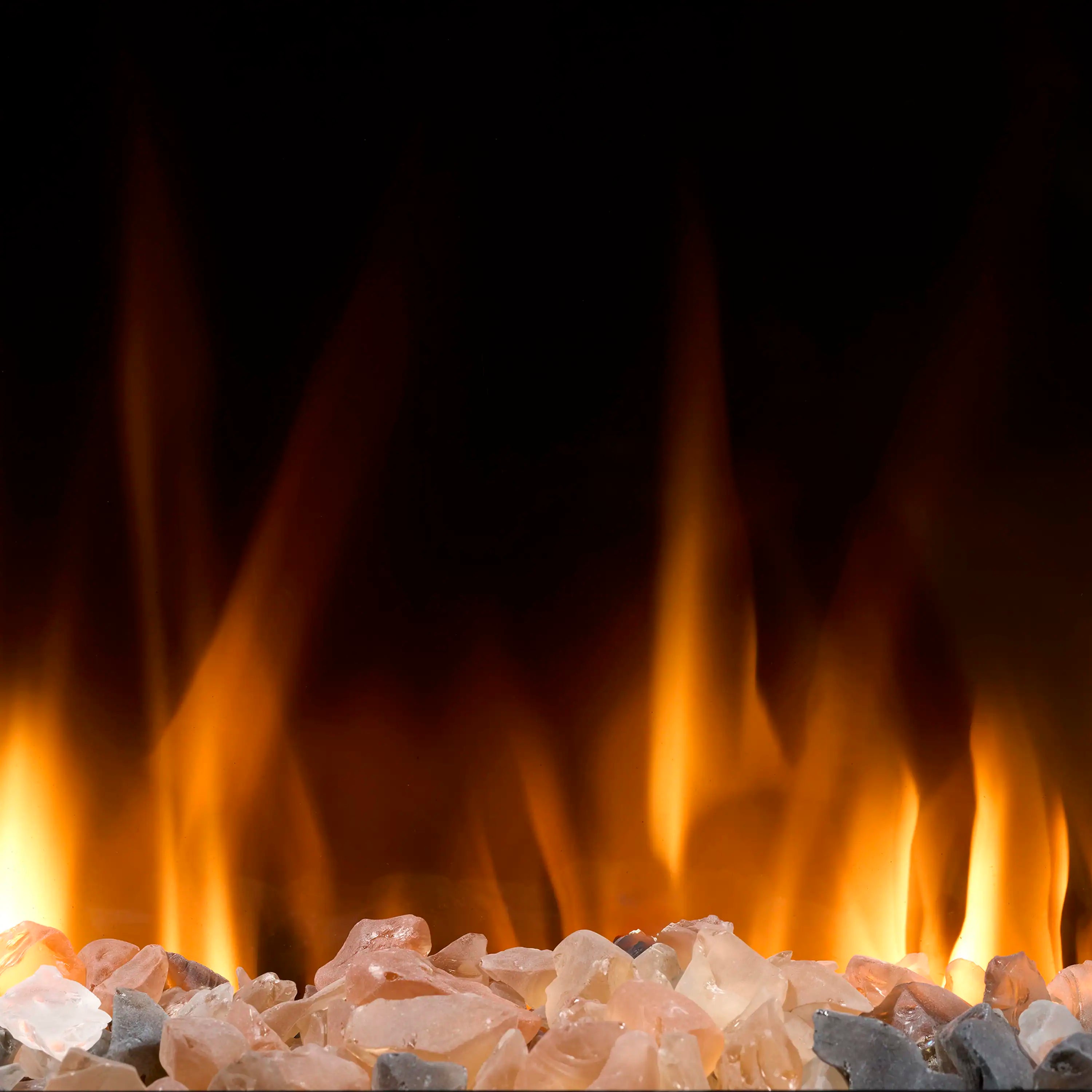 Linear electric fireplace flame effect above clear glass and rocks