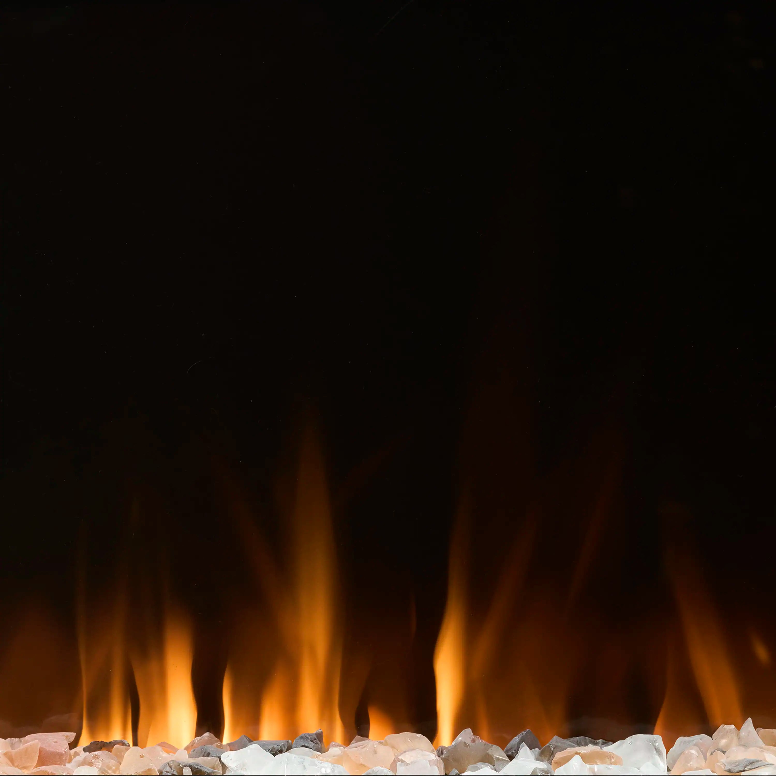 Electric fireplace flame effect over white crystals and charred log pieces