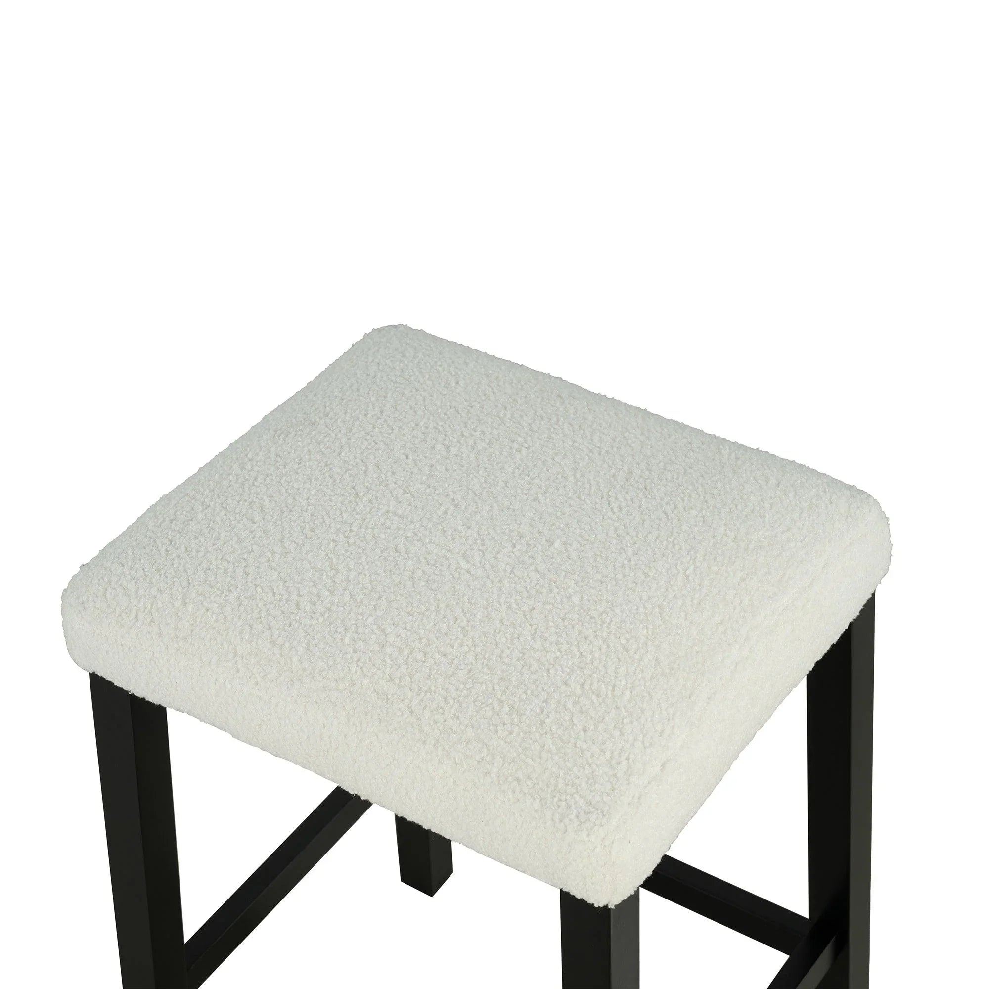 Black bar stool with square white upholstered seat and sturdy angled legs