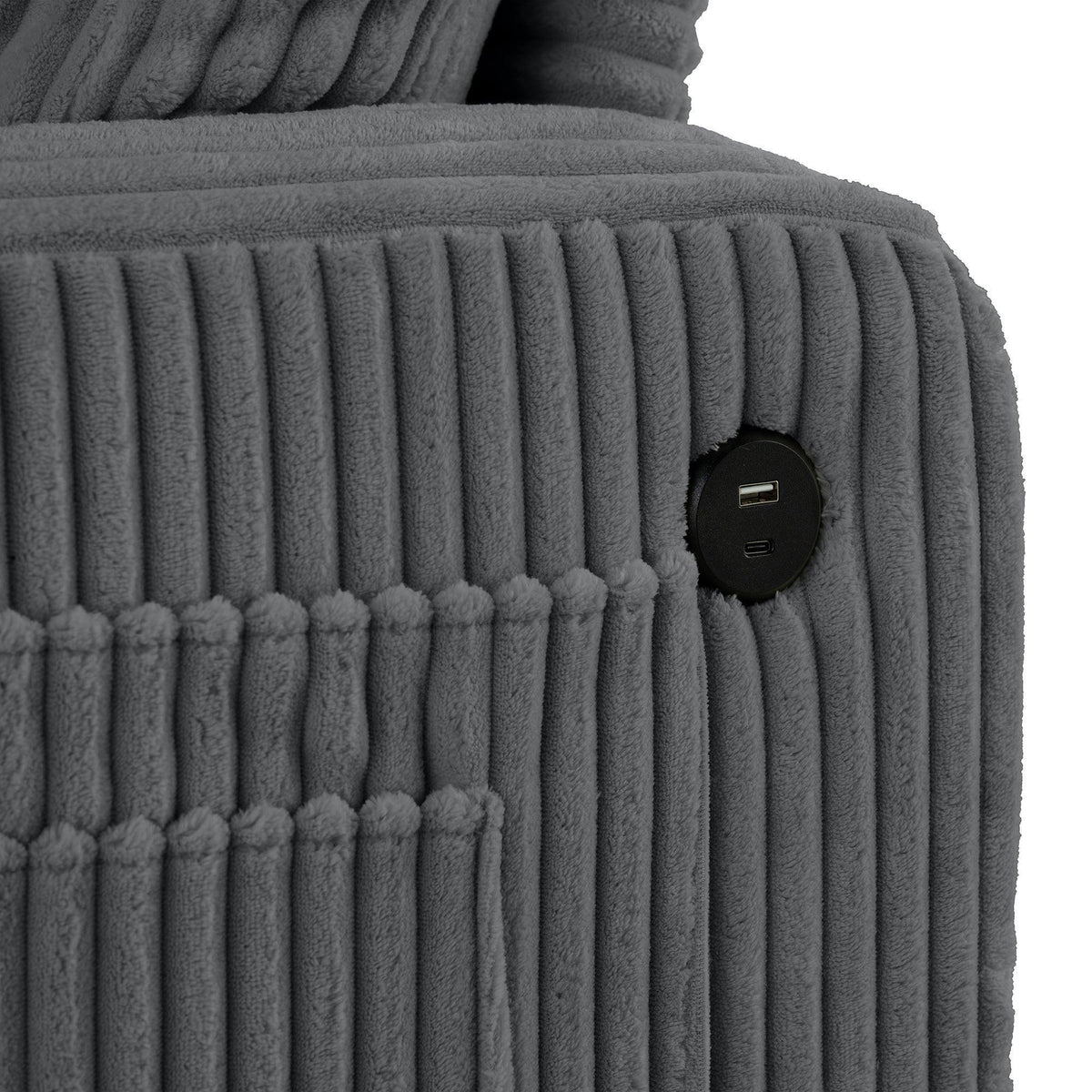 Dark gray sofa armrest with two USB ports and ribbed upholstery texture