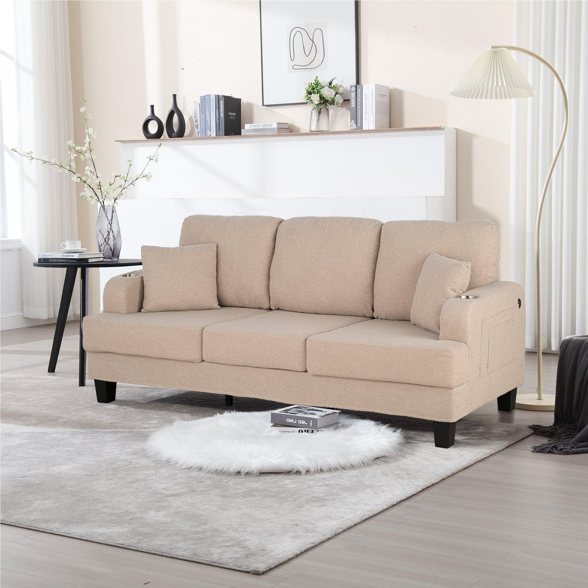 Beige 3-seat sofa with four throw pillows and dark legs