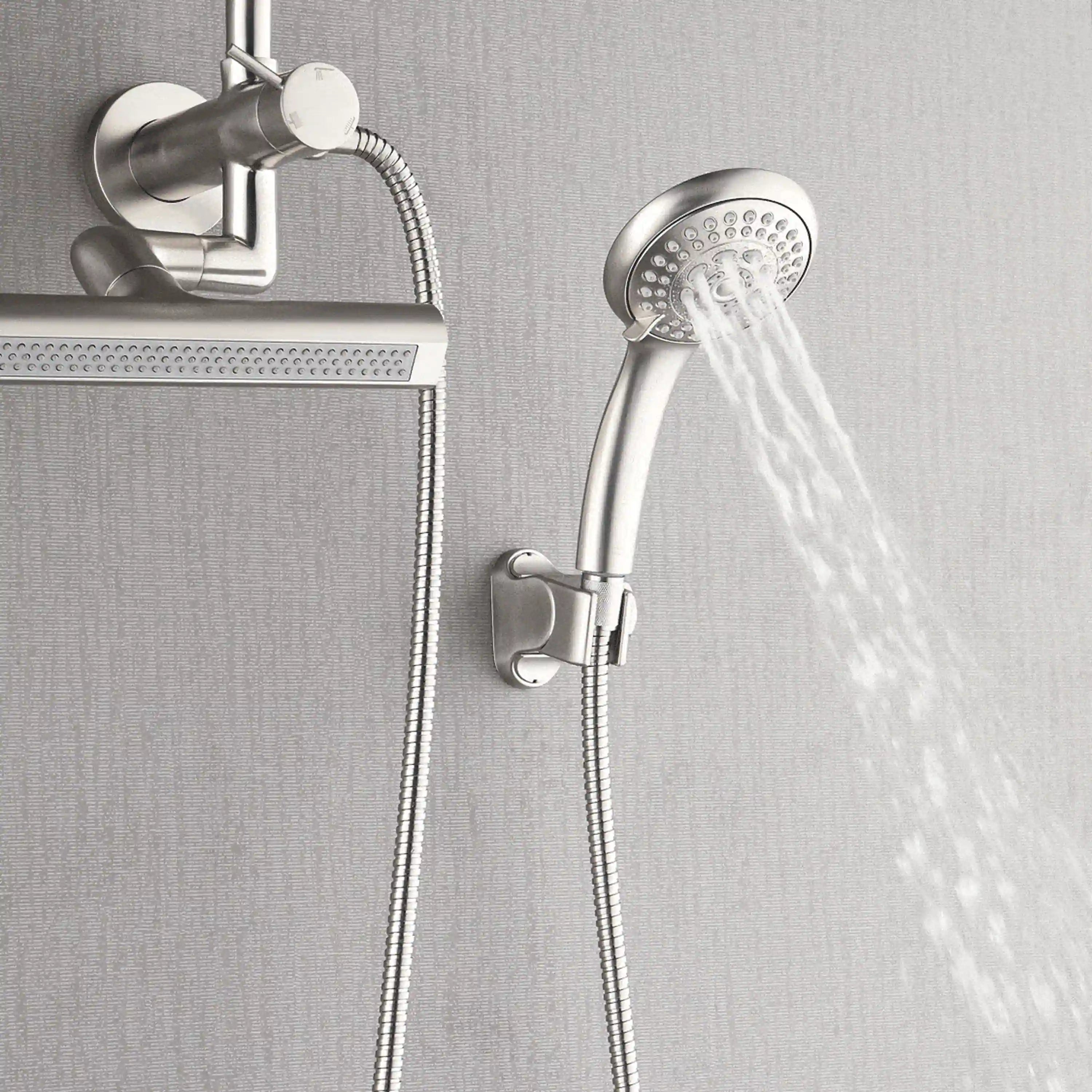 Brushed nickel handheld shower head with flexible hose, wall mount, and flowing water