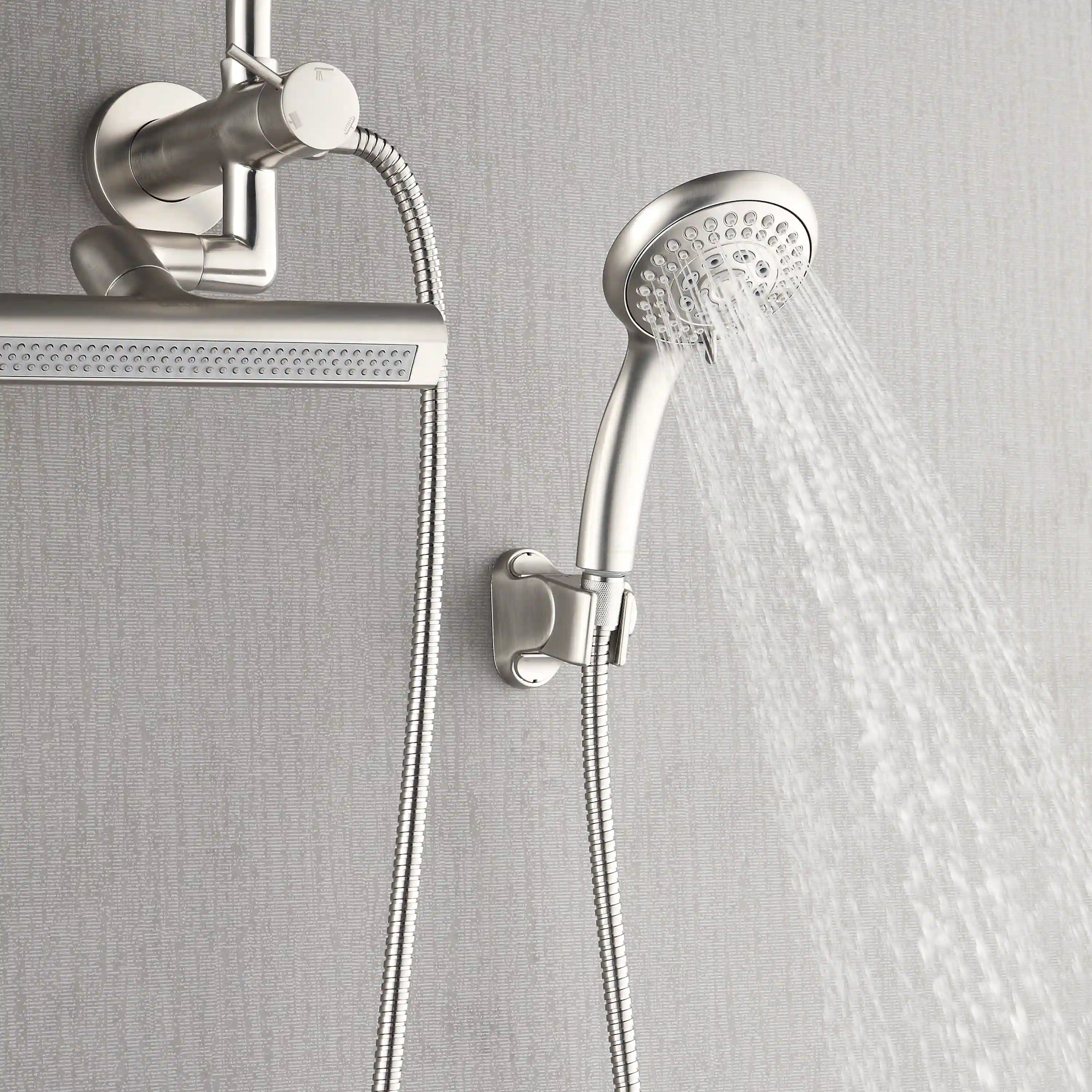 Handheld shower head with flexible hose and round wall holder, brushed nickel.