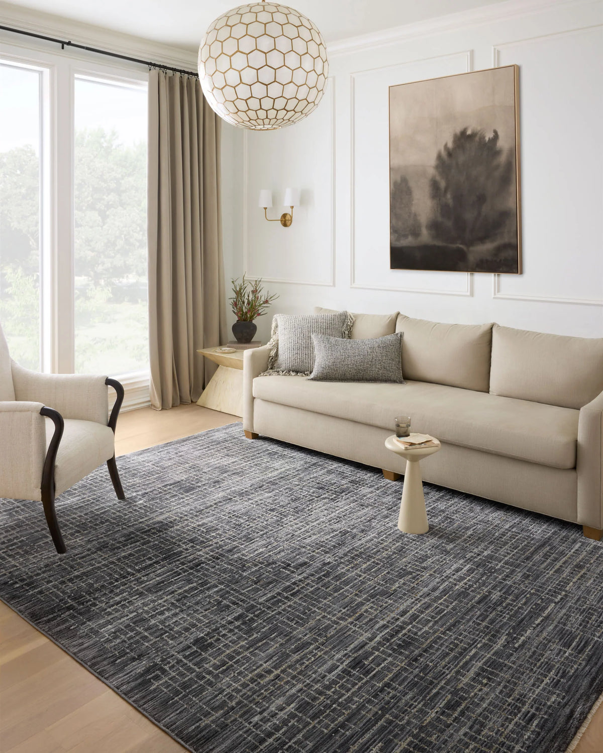Dark gray runner rug with silver and muted gold linear pattern in a living room
